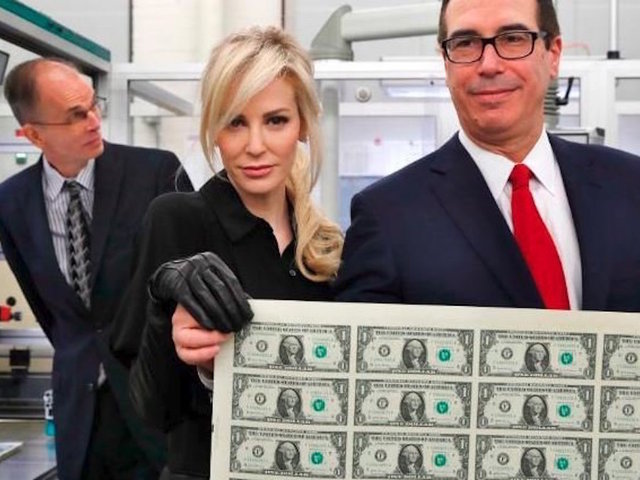 Treasury Secretary Steven Mnuchin's wife strikes a pose with a sheet of money