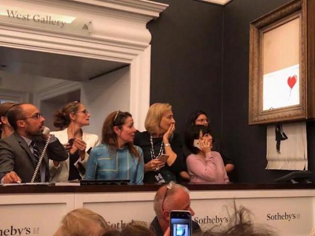 Who was in on Banksy's 'self-destruct' art stunt, and will the painting be more or less valuable?